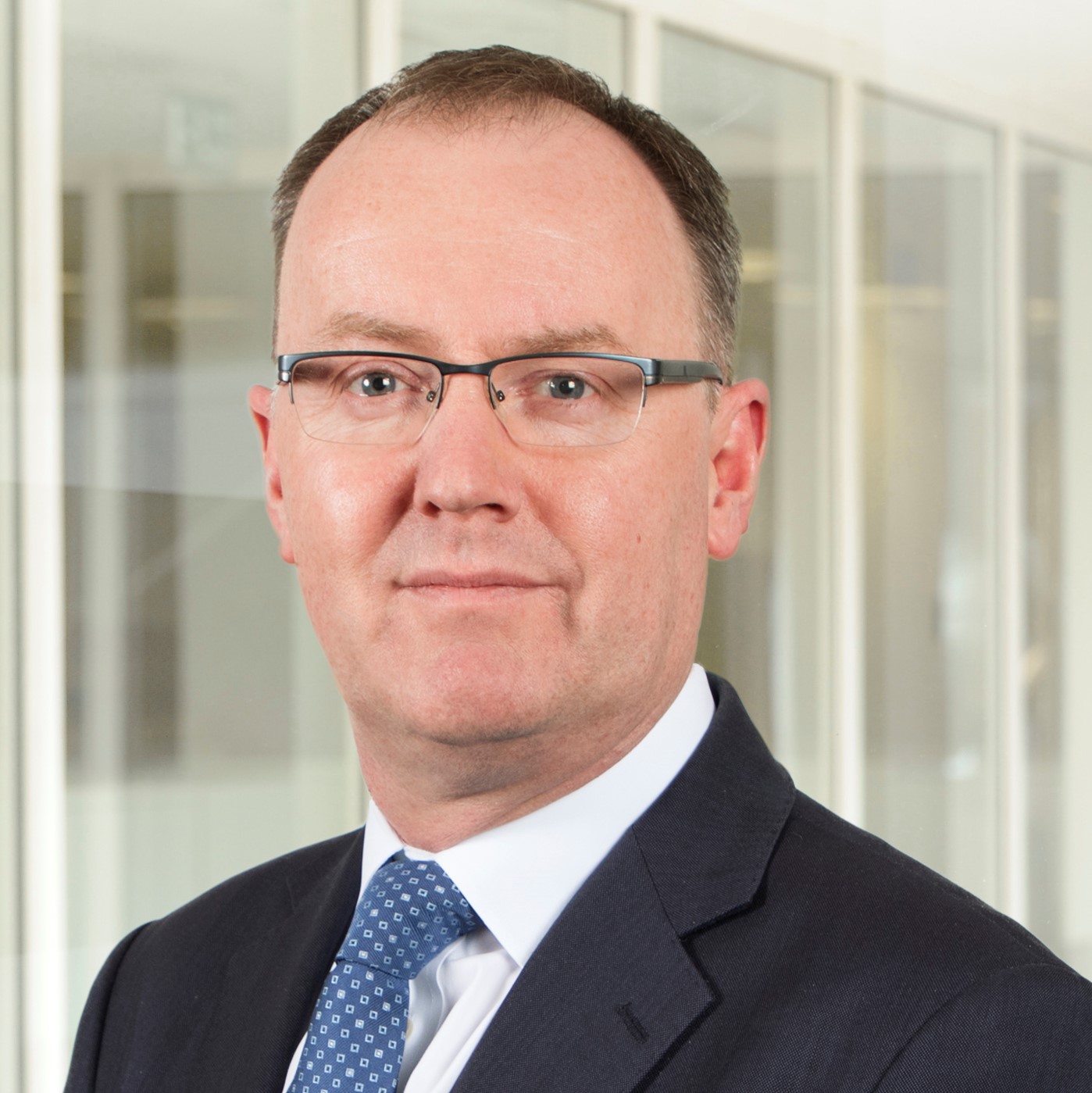 Man in suit with glasses